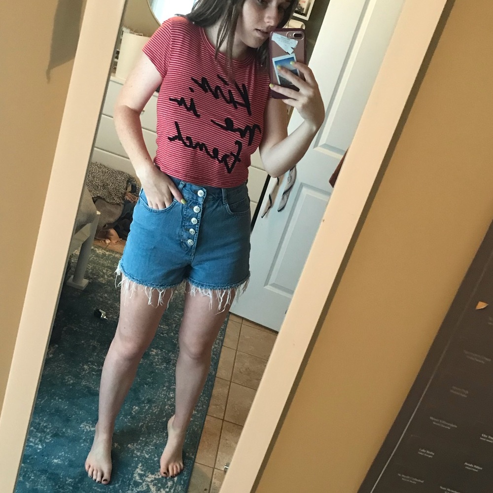 Red striped shirt with text.